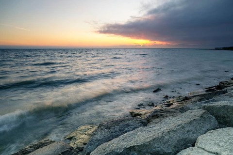 Morning atmosphere with light wind and waves Bank stabilisation in the harbour of Guettingen