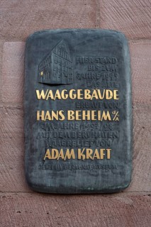 Information board on the former scales building about the scales relief by Hans Behaim from 1497