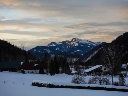 Evening clouds over snow-covered mountains