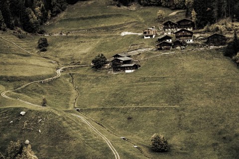 Old farms on mountain meadow