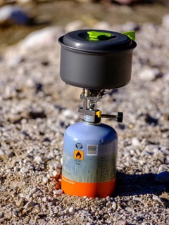 Camping cooker with gas cartridge and aluminium cooking pot
