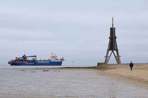 Dredger on the North Sea next to the Kugelbake