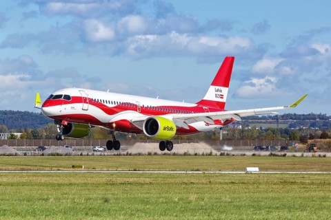 An Air Baltic Airbus A320 with the registration number YL-CSL in the special livery Latvia 100 at the airport in Stuttgart