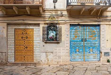 Colorful painted roller shutters on shop display window