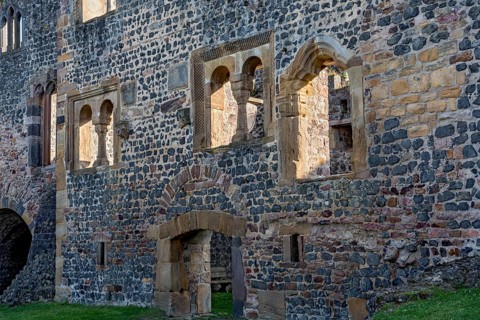 Facade of the Romanesque Muenzenberg Palas with windows and arcades