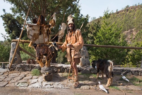 Goat herder in traditional garb