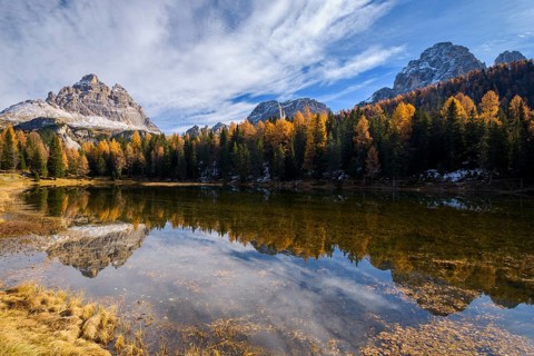 Antorno lake towards Tre Cime di Lavaredo mountain reflected in lake