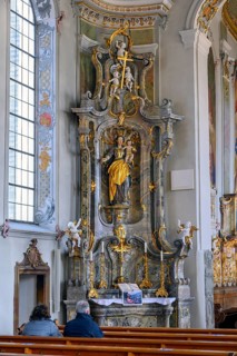 Side altar with figure of the Virgin Mary