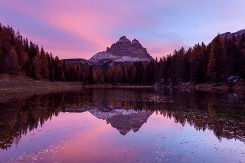 Antorno lake towards Tre Cime di Lavaredo mountain at dawn reflected in lake
