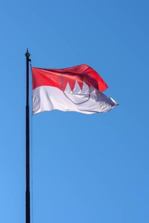 Waving Franconian flag in the blue sky