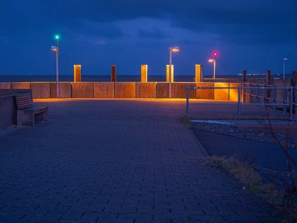 Harbour entrance with position lights in the evening at blue hour