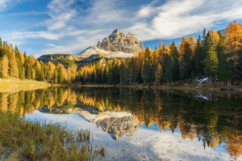 Antorno lake towards Tre Cime di Lavaredo mountain reflected in lake