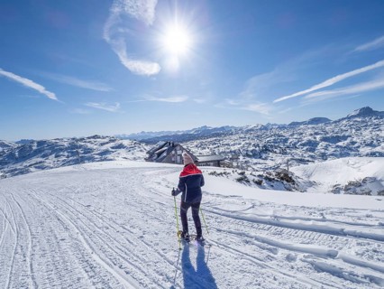 Snowshoe hiker in winter landscape in the high mountains