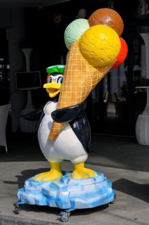 Penguin figure with ice cream cone