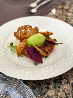 Avocado dip with toasted bread and salmon tartare