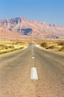 Endless straight road through the desert