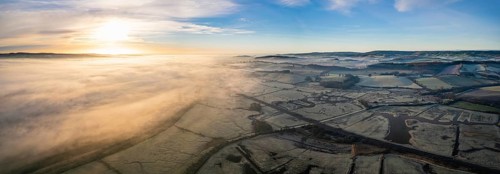 Sunrise panorama over RSPB Exminster and Powderham Marshes and River Exe