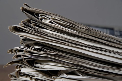 Pile of newspapers read out in the household
