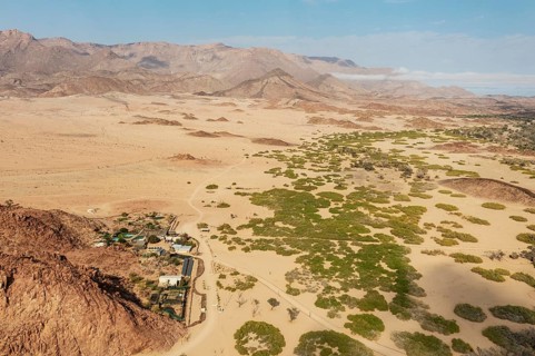 The Brandberg White Lady Lodge at the edge of the dry river bed of the Ugab river