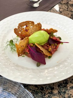 Avocado dip with toasted bread and salmon tartare