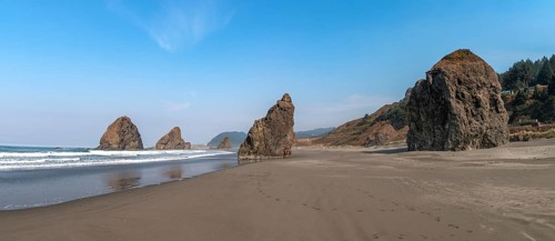 Sandy beach beach with sea and big rocks