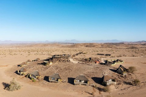 The Doro Nawas Camp and arid desert plains at the edge of the dry river bed of the Aba-Huab river
