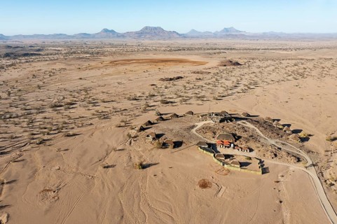 The Doro Nawas Camp and arid desert plains at the edge of the dry river bed of the Aba-Huab river
