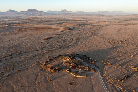 The Doro Nawas Camp and arid desert plains at the edge of the dry river bed of the Aba-Huab river