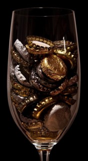 Crown caps collected in a beer glass