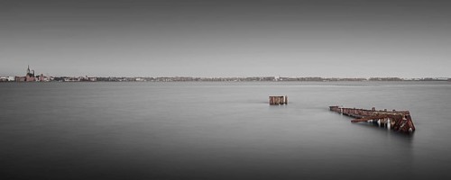 Long exposure of an old rusty jetty on the Baltic Sea coast off Stralsund