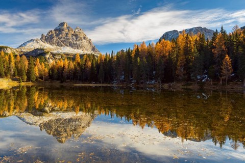 Antorno lake towards Tre Cime di Lavaredo mountain reflected in lake