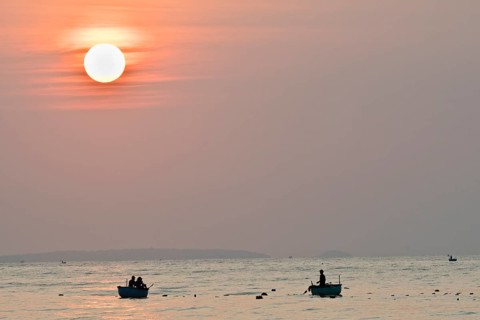 Fishing boats at sunrise