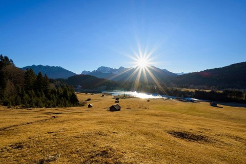 Sunrise over Karwendel mountain range with frozen lake
