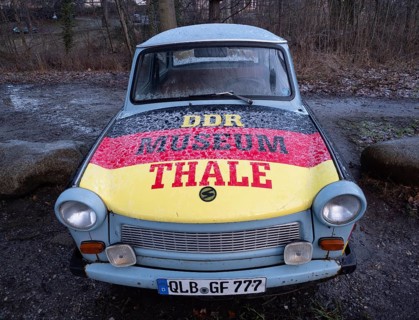 Advertisement for the GDR Museum in Thale on a Trabant in the colours black