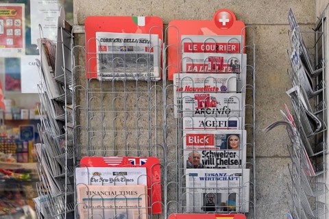 Sales stand with various daily newspapers