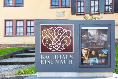 Sign on the Bach House with its seal and information about the museum