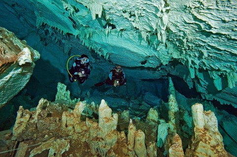 Scuba diver in easy-to-dive freshwater stalactite cave like Cenote