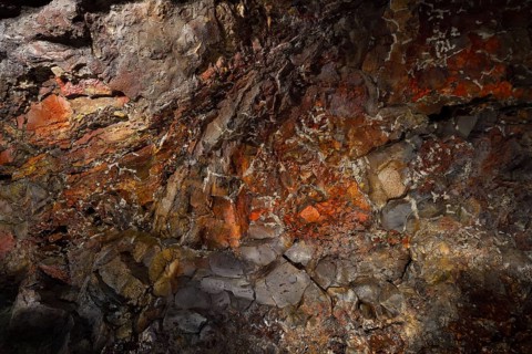 Colourfully illuminated areas of the Cueva de los Verdes