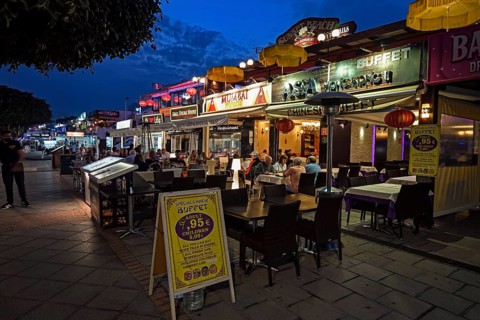 Shops and restaurants in the evening on the beach promenade