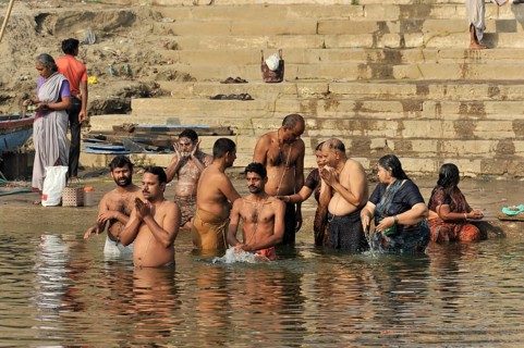 Worshippers on the banks of the Ganges during ritual ablutions in Varanasi