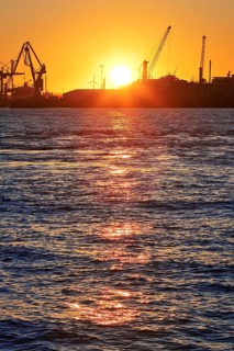 Norderelbe with cranes at sunrise