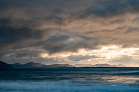 North Atlantic with rock needle and cloudy sky