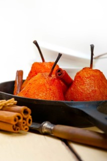 Poached pears delicious home made recipe ove white rustic wood table
