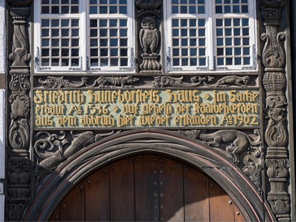 Lettering and wood carvings above the entrance gate of Huneborstel's House