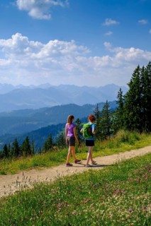 Hiker at the summit of Weiherkopf near Bolsterlang