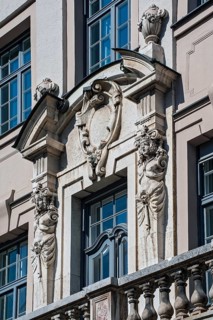 Facade with balcony and caryatids