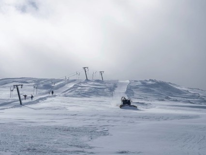 Snow groomer or Pistenbully levels ski slope