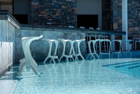 Bar and bar stools by the swimming pool