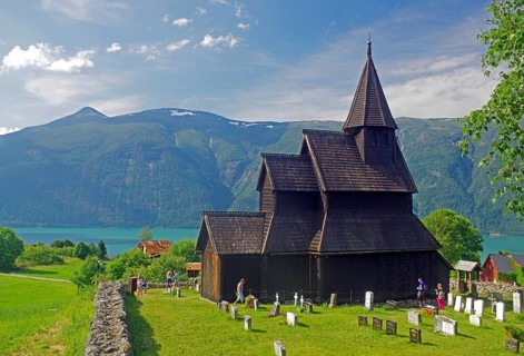 Wooden church standing over the fjord