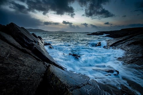 Sea surf on rocky coast